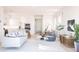 Open-concept living area with a modern sofa, stylish furniture, and seamless flow to kitchen and dining at 12536 Westhaven Oak Dr # 111, Winter Garden, FL 34787