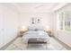Clean bedroom with a large bed, bedside tables, and a comfortable bench at 12536 Westhaven Oak Dr # 111, Winter Garden, FL 34787