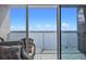 Balcony features outdoor seating and expansive water views with railings for safety at 13415 Blue Heron Beach Dr # 710, Orlando, FL 32821