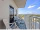 Cozy balcony with white railing and seating, offering amazing views at 13415 Blue Heron Beach Dr # 710, Orlando, FL 32821