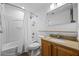 Bathroom with a shower-tub combination, wood vanity, and modern mirror at 13415 Blue Heron Beach Dr # 710, Orlando, FL 32821