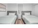 Bedroom featuring two beds, a window, and a nightstand between them at 13415 Blue Heron Beach Dr # 710, Orlando, FL 32821