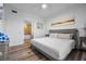 Modern bedroom featuring a luxurious bed and sleek en-suite bathroom with a tub and glass door at 13415 Blue Heron Beach Dr # 710, Orlando, FL 32821