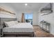 Comfortable bedroom with a flat-screen TV, access to a balcony, and a large closet at 13415 Blue Heron Beach Dr # 710, Orlando, FL 32821