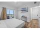 Bright bedroom with balcony access, a TV, and a closet for easy living at 13415 Blue Heron Beach Dr # 710, Orlando, FL 32821