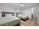 Bedroom with two beds, closet, hardwood floors and a ceiling fan at 13415 Blue Heron Beach Dr # 710, Orlando, FL 32821