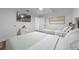 Bedroom with two beds, a wall-mounted TV, and modern decor at 13415 Blue Heron Beach Dr # 710, Orlando, FL 32821