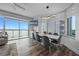 Dining area with scenic view, contemporary table, stylish lighting, and open concept layout to living room at 13415 Blue Heron Beach Dr # 710, Orlando, FL 32821