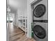 Hallway with bunk beds and a stacked washer and dryer in a closet at 13415 Blue Heron Beach Dr # 710, Orlando, FL 32821