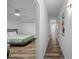 Bright hallway leading to a bedroom with light hardwood floors and recessed lighting at 13415 Blue Heron Beach Dr # 710, Orlando, FL 32821