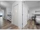 Bright hallway featuring wood-look floors leading to bedrooms and a bunk room with built-in ladder at 13415 Blue Heron Beach Dr # 710, Orlando, FL 32821