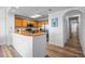 A kitchen that features wood cabinets and a breakfast bar connecting to the living area at 13415 Blue Heron Beach Dr # 710, Orlando, FL 32821