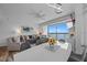 Open concept living area with sliding doors to balcony and scenic views; contemporary and upscale decor at 13415 Blue Heron Beach Dr # 710, Orlando, FL 32821