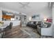 A bright and open living area with a view of the kitchen and balcony access at 13415 Blue Heron Beach Dr # 710, Orlando, FL 32821