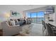 Comfortable living space with balcony access showcasing scenic views; cozy seating arrangement and modern decor at 13415 Blue Heron Beach Dr # 710, Orlando, FL 32821