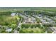 Expansive aerial view showcasing community, lake, and nearby park at 14526 Chicora Crossing Blvd, Orlando, FL 32828