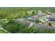 Aerial view of homes surrounded by lush landscaping and mature trees within the community at 14526 Chicora Crossing Blvd, Orlando, FL 32828