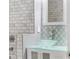 Elegant bathroom featuring a glass vessel sink, decorative tile, and modern fixtures at 14526 Chicora Crossing Blvd, Orlando, FL 32828