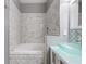 Stylish bathroom with a soaking tub, custom tile work, and a glass vessel sink at 14526 Chicora Crossing Blvd, Orlando, FL 32828