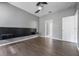 Modern bedroom with hardwood floors and a minimalist, wall-mounted headboard at 14526 Chicora Crossing Blvd, Orlando, FL 32828