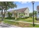 Charming yellow single-Gathering home with manicured lawn and lush landscaping at 14526 Chicora Crossing Blvd, Orlando, FL 32828