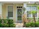 Close up of the front door entrance of a lovely yellow house at 14526 Chicora Crossing Blvd, Orlando, FL 32828