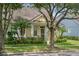 Charming yellow single-Gathering home with manicured lawn and lush landscaping at 14526 Chicora Crossing Blvd, Orlando, FL 32828