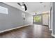 Spacious living room featuring wood floors, modern ceiling fans, and natural light at 14526 Chicora Crossing Blvd, Orlando, FL 32828