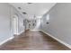 Spacious living room featuring wood floors, modern ceiling fans, and natural light at 14526 Chicora Crossing Blvd, Orlando, FL 32828