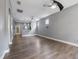 Spacious living room featuring wood floors, modern ceiling fans, and natural light at 14526 Chicora Crossing Blvd, Orlando, FL 32828