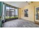 Relaxing screened-in porch with a window, door and a view of the back yard at 14526 Chicora Crossing Blvd, Orlando, FL 32828