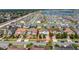 A birds-eye view of a neighborhood with many similar houses and well-kept lawns at 14962 Fells Ln, Orlando, FL 32827