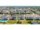 Aerial view of homes in the neighborhood with beautiful lawns and mature landscaping at 14962 Fells Ln, Orlando, FL 32827