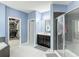 Bathroom featuring a walk-in shower, dual sink vanity, and a soaking tub at 14962 Fells Ln, Orlando, FL 32827