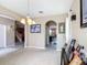 Open floor plan featuring a dining area leading to the kitchen and stairs, maximizing space and functionality at 14962 Fells Ln, Orlando, FL 32827