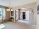 Open-concept featuring the foyer leading to a dining area and office space, creating a functional layout at 14962 Fells Ln, Orlando, FL 32827