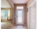 Bright foyer featuring an decorative glass front door and neutral color scheme at 14962 Fells Ln, Orlando, FL 32827