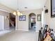 Spacious living room featuring archways that look into the kitchen and entryway at 14962 Fells Ln, Orlando, FL 32827