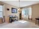 Cozy living room featuring carpet flooring, neutral walls, and natural light at 14962 Fells Ln, Orlando, FL 32827