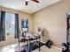 Cozy office with window view and ceiling fan at 14962 Fells Ln, Orlando, FL 32827