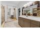 Large mirror and vanity are featured in this bathroom with a walk-in shower at 157 Ambergate Ct, Debary, FL 32713