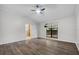 Bright bedroom features a ceiling fan, neutral walls, and wood-look flooring at 157 Ambergate Ct, Debary, FL 32713