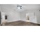 Spacious bedroom featuring neutral walls, hard flooring, and an ensuite bathroom at 157 Ambergate Ct, Debary, FL 32713
