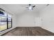 Neutral bedroom with hard wood flooring, a ceiling fan, and natural light at 157 Ambergate Ct, Debary, FL 32713