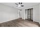 Spacious bedroom features sleek floors, ceiling fan, and ample closet space at 157 Ambergate Ct, Debary, FL 32713