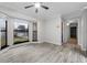 Bright bedroom with bay windows and hard wood floors is brightly lit and airy at 157 Ambergate Ct, Debary, FL 32713