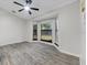Bright bedroom featuring light gray floors, a ceiling fan, and bay window at 157 Ambergate Ct, Debary, FL 32713