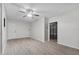 Light and airy bonus room with modern floors and access to the garage at 157 Ambergate Ct, Debary, FL 32713