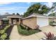 Charming single-story brick home featuring well-manicured landscaping and a two-car garage at 157 Ambergate Ct, Debary, FL 32713
