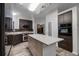 Modern kitchen with an island, stainless steel appliances and plenty of cabinet space at 157 Ambergate Ct, Debary, FL 32713
